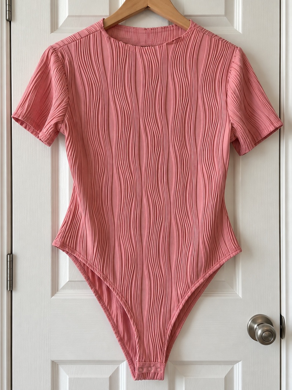 Womenâs Rose Pink Ribbed One-Piece Bodysuit, size large